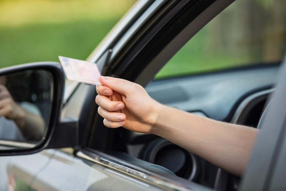 Driver Handing Over His Drivers License