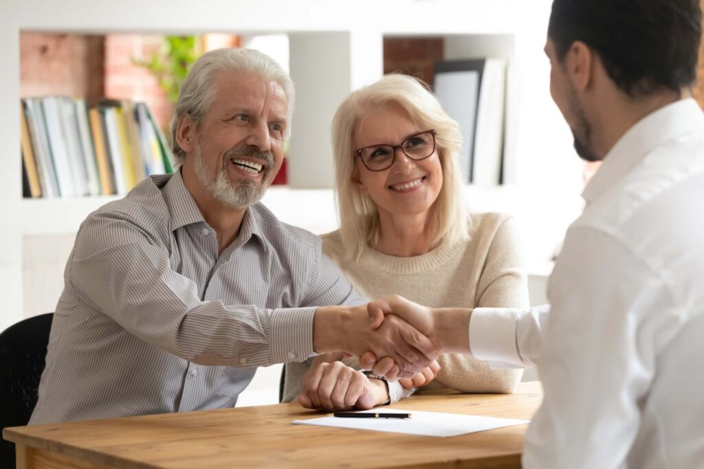 Happy senior couple clients doing financial insurance business