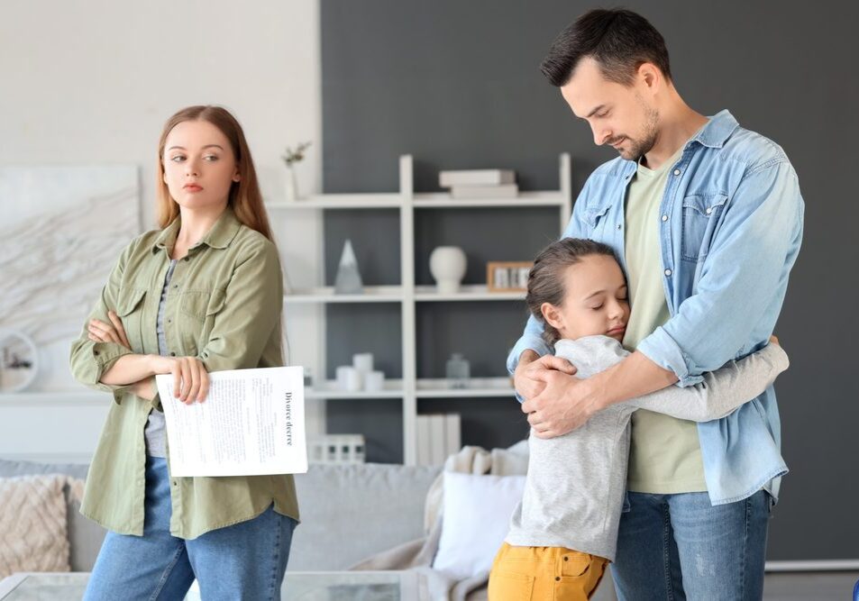 Family with child, woman holding document.