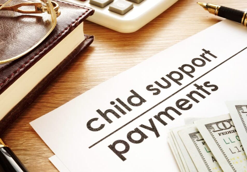 Child support payments document with money.