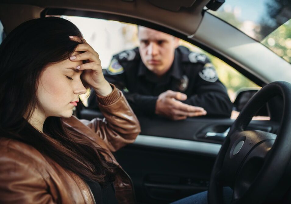Driver stressed during police traffic stop.