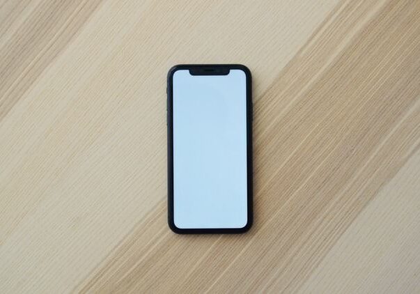 Smartphone with blank screen on table.