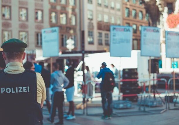 Police officer monitoring a public event crowd.